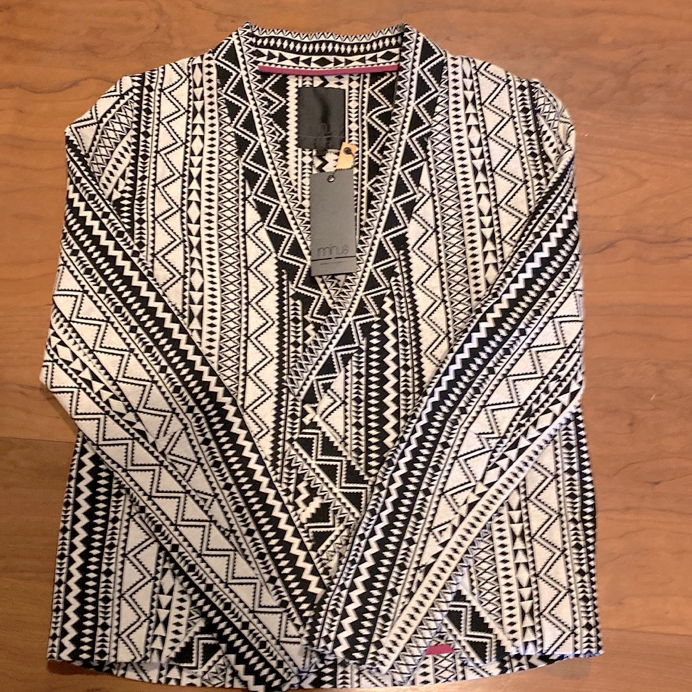 Brand new black and white blazer. Never worn with tags. Size 36 or medium